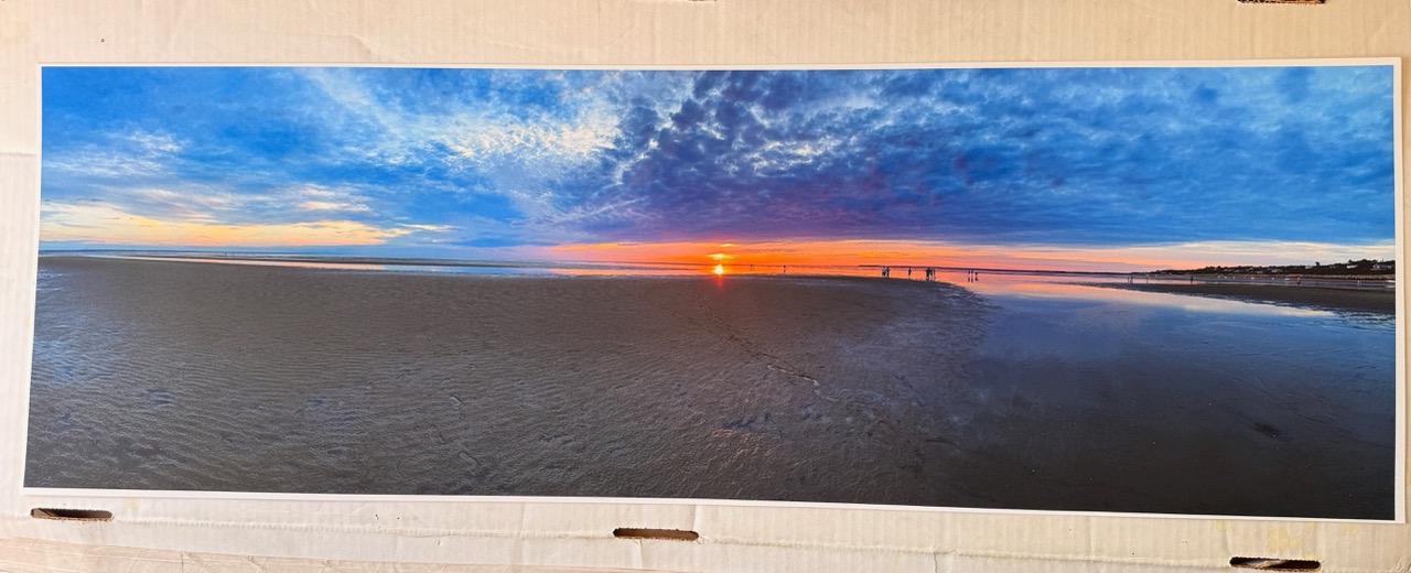 A panorama print of a beach at sunset from the Canon printer. 