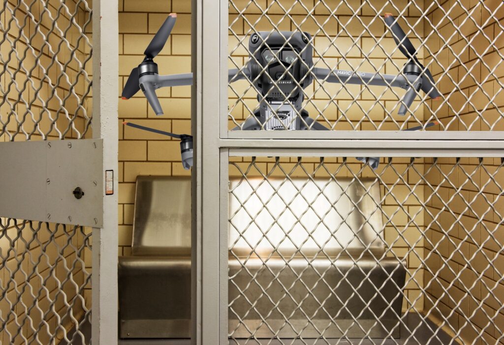 An editorial image of a DJI done behind bars in jail.