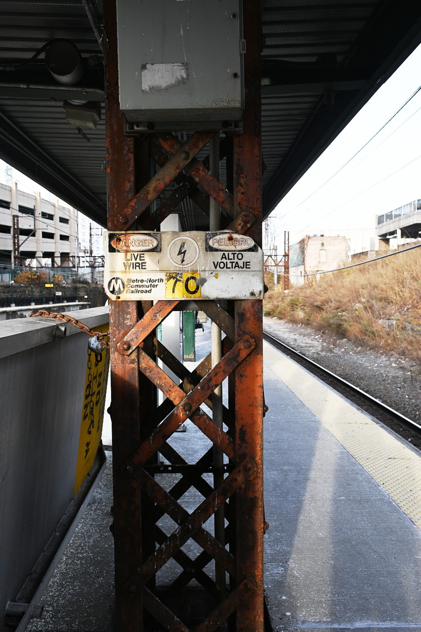 a rusty support pillar at an MTA train station showing the detail capable with this lens. 